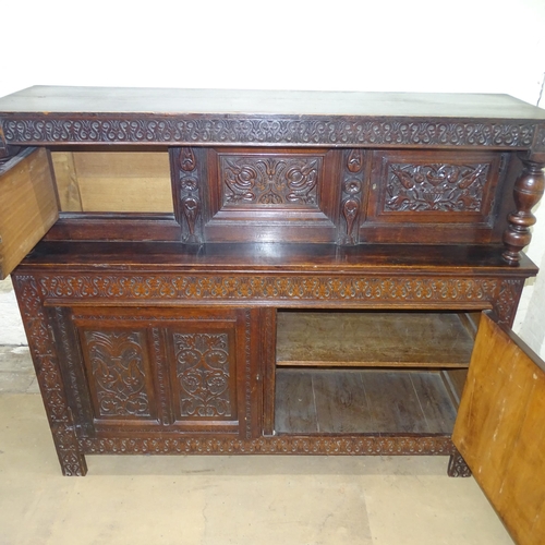 2076 - An antique carved oak court cupboard. 182x153x53cm