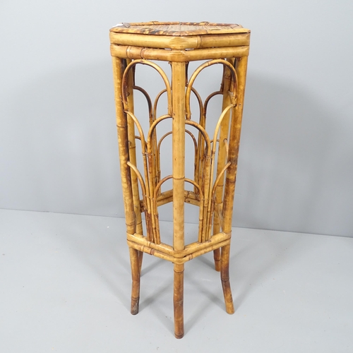 2092 - A bamboo hexagonal jardiniere stand. Height 72cm.