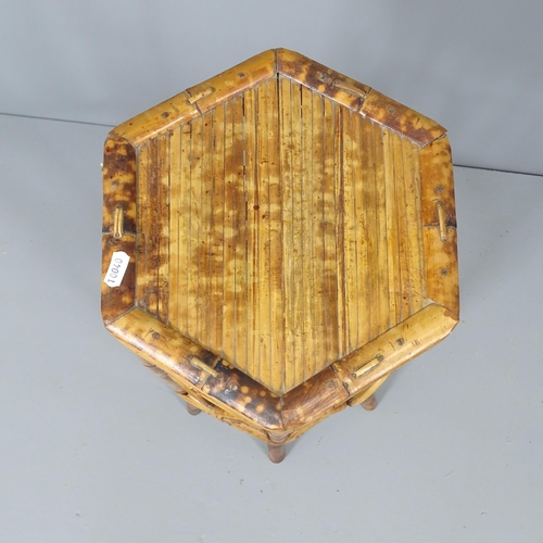 2092 - A bamboo hexagonal jardiniere stand. Height 72cm.