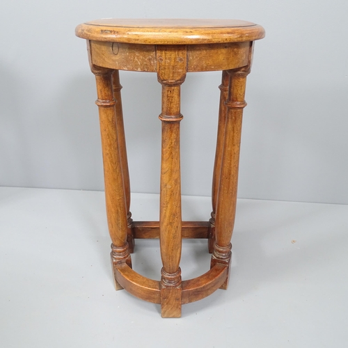 2093 - An antique oak demilune jardiniere stand. 36x63x30cm.