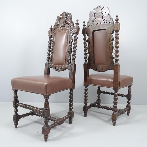 2098 - A pair of oak and faux-leather upholstered Carolean style hall chairs, with carved decoration, barle... 