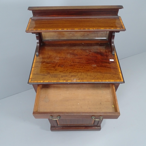 2100 - An Edwardian mahogany and satinwood strung music cabinet, with raised mirrored back and single panel... 