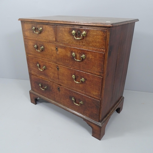 2106 - A 19th century oak chest of two short and three long drawers, raised on bracket feet. 87x87x52cm.