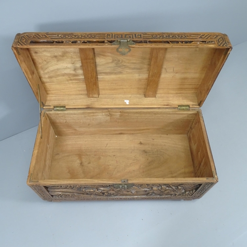 2108 - A Chinese camphorwood blanket box, with all-over carved decoration. 89x48x44cm.