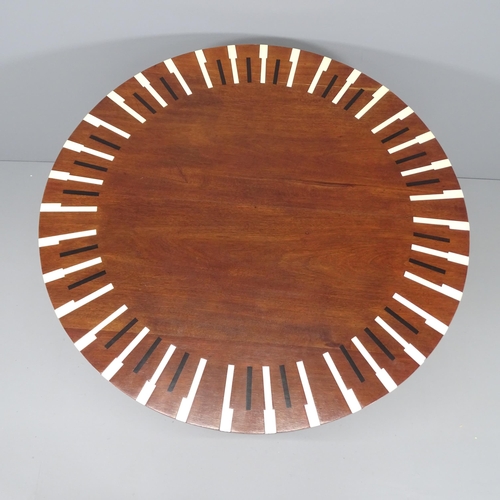 2116 - A mid-century design dining table with mahogany top, inlaid with piano key design on lacquered weath... 