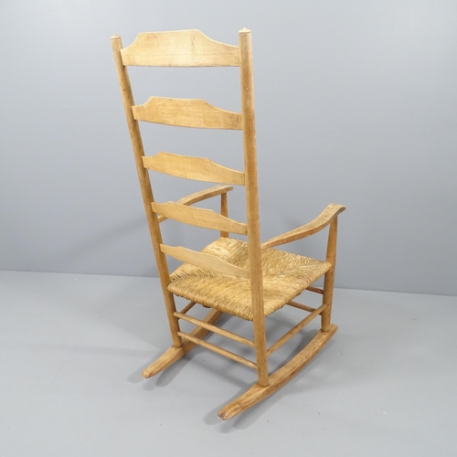 2119 - Neville Neal, an LCC Arts & Crafts Cotswold school Ernest Gimson design ladder back rocking chair in... 