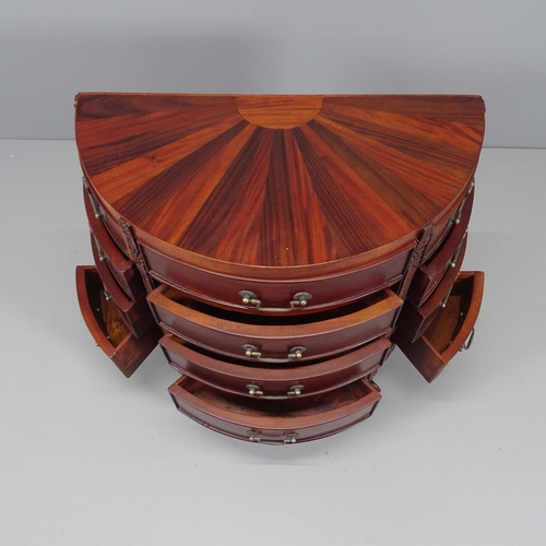 2123 - A modern mahogany demi-lune chest of twelve drawers, with sunburst design top and raised on claw sha... 