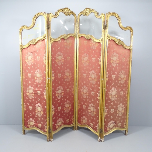 2126 - An antique continental gilt painted and upholstered four-fold room divider screen with glass panels.... 