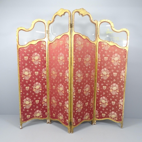 2126 - An antique continental gilt painted and upholstered four-fold room divider screen with glass panels.... 