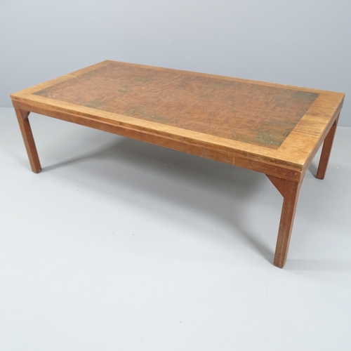 2132 - A mid-century teak coffee table, the top being teak veneered and having an inset copper top. 140x45x... 