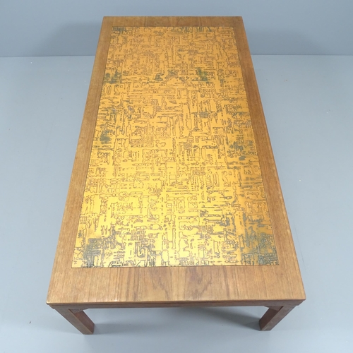 2132 - A mid-century teak coffee table, the top being teak veneered and having an inset copper top. 140x45x... 