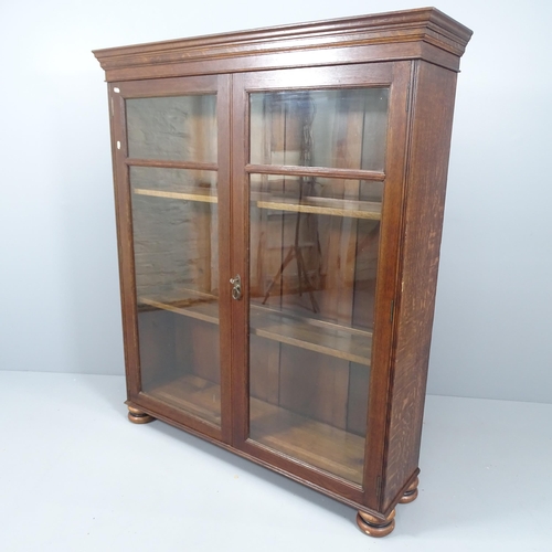 2135 - A Victorian mahogany bookcase with two glazed doors and three adjustable shelves. 122x144x32cm. With... 