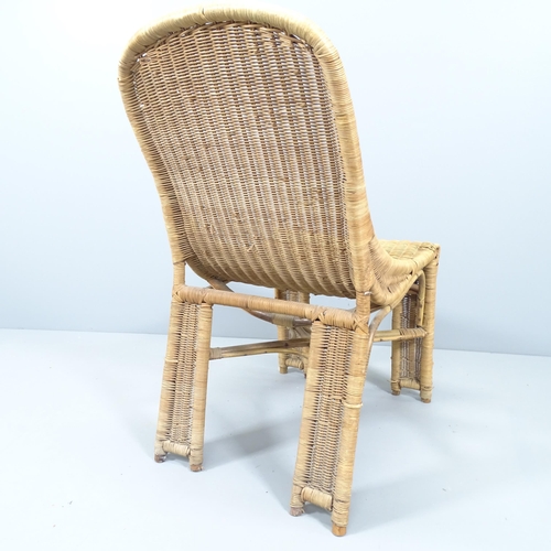 2138 - A mid-century French wicker chair in the manner of Louis Sognot.