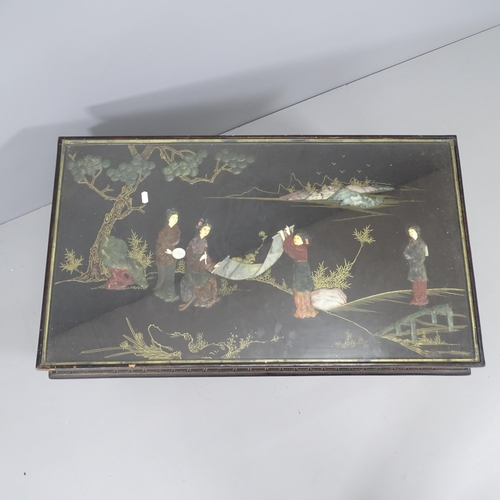 2140 - A Chinese black lacquered coffee table, with hardstone, ivory and gilt-painted decoration and inset ... 