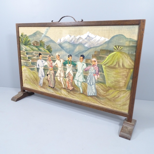 2147 - An oak framed fire screen with painted and embroidered panel depicting a rural oriental scene. 141x9... 