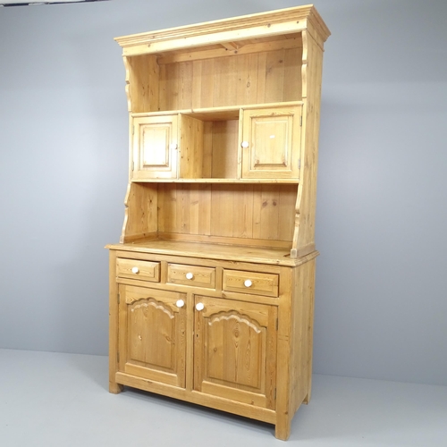 2148 - A vintage pine two-section dresser. 121x218x52cm