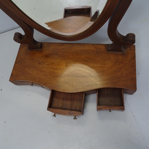 2690 - A Victorian mahogany shield-shaped swing toilet mirror with drawer fitted base. 56x68x27cm