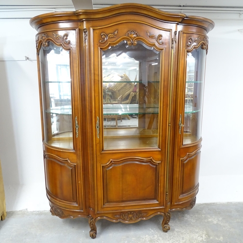 2654 - A modern continental-style oak  display cabinet, with three glazed panelled doors and four fixed she... 