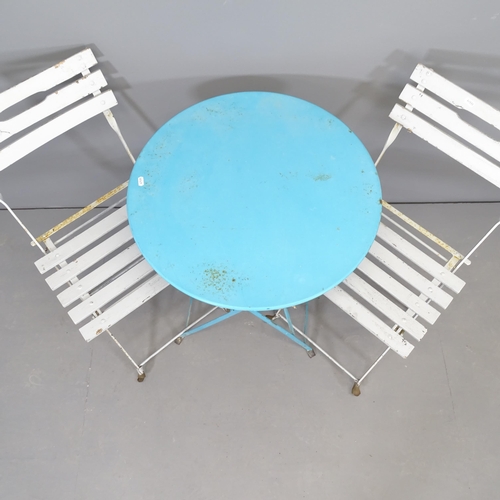 2660 - A painted metal folding bistro table, 60x70cm, and two folding chairs.