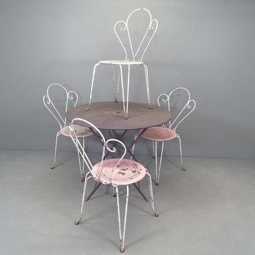 2661 - A painted metal folding circular-topped garden table, 96x75cm and four painted wrought metal stackin... 