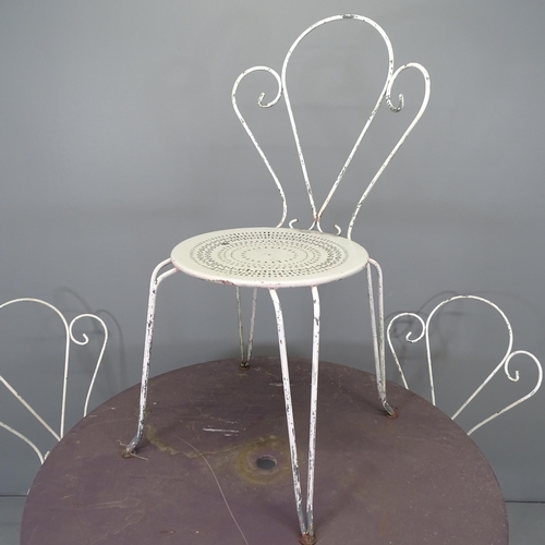 2661 - A painted metal folding circular-topped garden table, 96x75cm and four painted wrought metal stackin... 