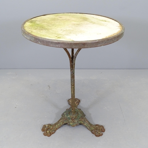 2663 - A vintage circular marble top garden table on wrought metal base. 55x73cm