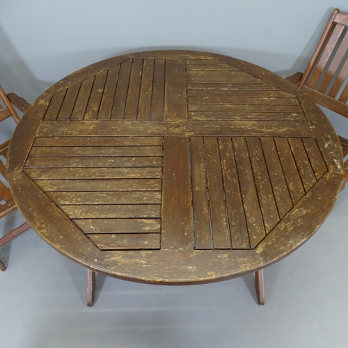 2676 - A teak folding circular garden table with label for Kingdom Teak, 120x76cm and four teak folding gar... 