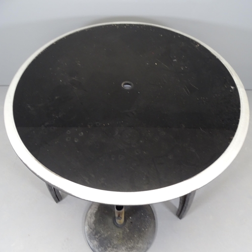 2677 - A modern circular glass topped garden table on metal frame, with parasol stand. 121x74xm