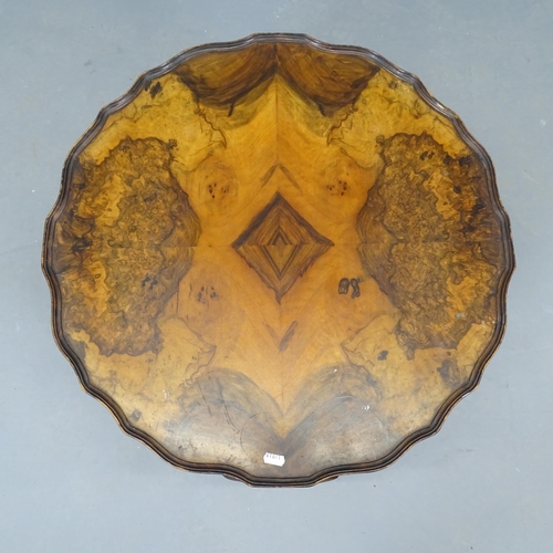 2691 - An antique burr walnut circular occasional table, with piecrust edge, and raised on cabriole legs wi... 