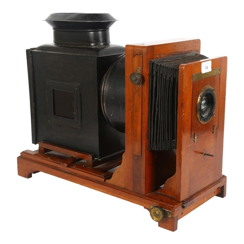 14 - An Antique magic lantern, with sliding projector and bellows, mahogany-mounted, fitted with electric... 