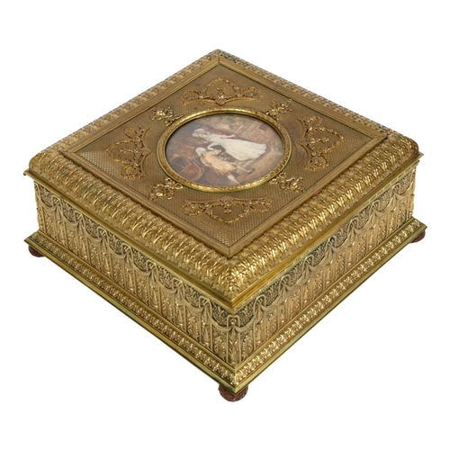 21 - An ornate French gilt-metal casket, circa 1900, central hand painted ivorine panel depicting 2 lover... 