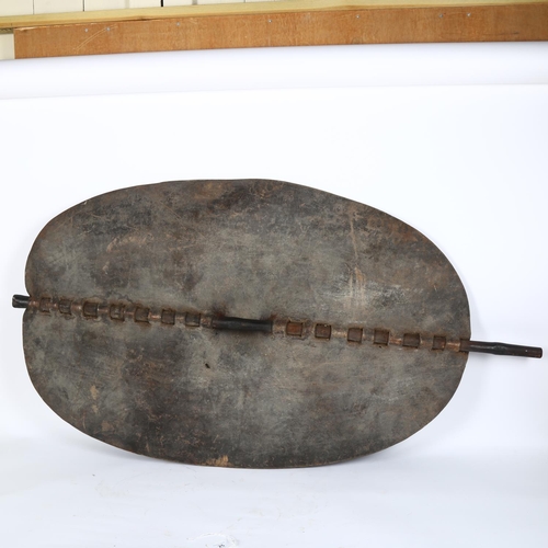 25 - An Nuer tribal shield, Southern Sudan, overall height 116cm