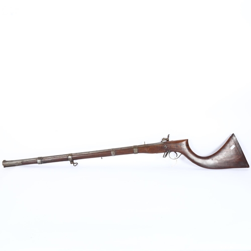 6 - A 19th century Afghan/Indian musket with trumpet stock, with trigger guard and lock mechanism, and a... 