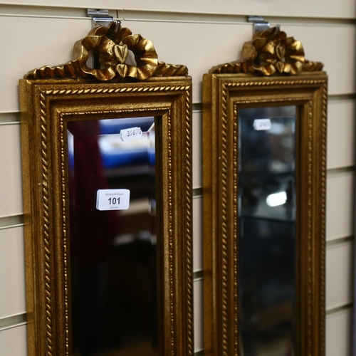 101 - A pair of modern rectangular gilt-framed bevel-edge mirrors of narrow form, with ribbon mount, L122c... 