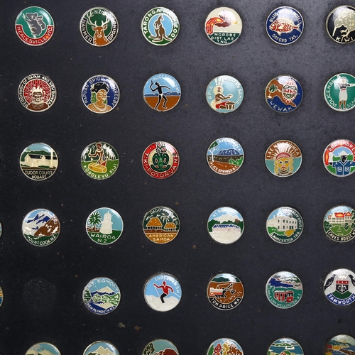 112 - A collection of enamel pin badges, all stuck to single board, all depicting places in Papua New Guin... 