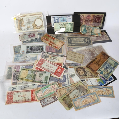 118 - A large quantity of world banknotes, including French 100 francs, 20 Hong Kong dollars, blue £5 note... 