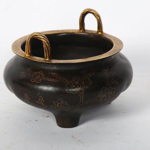 119 - A Chinese bronze 2-handled censer, with gilded bamboo and blossom decoration, on 3 feet, width 12cm,... 