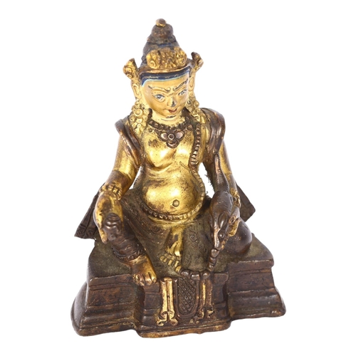 135 - A small Tibetan patinated bronze Jambhala, H9cm