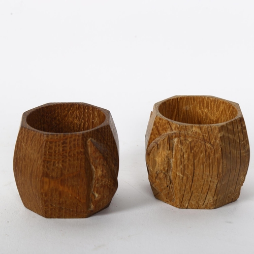 148 - ROBERT MOUSEMAN THOMPSON - pair of canted oak napkin rings with carved mouse, H5cm