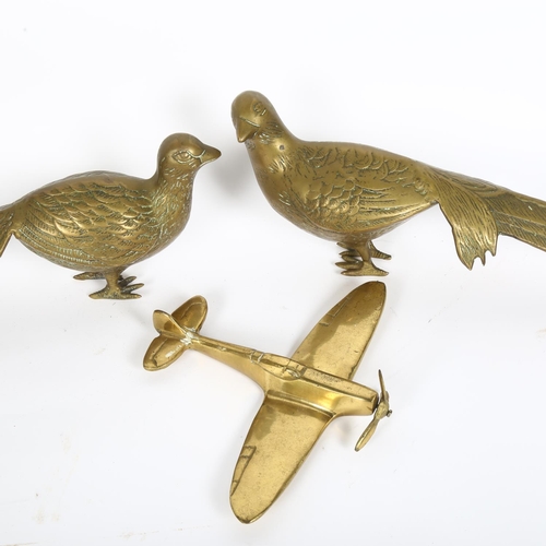 167 - A pair of brass table pheasants and a study of a Spitfire (3)