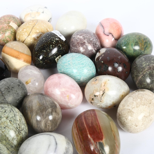 174 - A collection of hardstone and other eggs