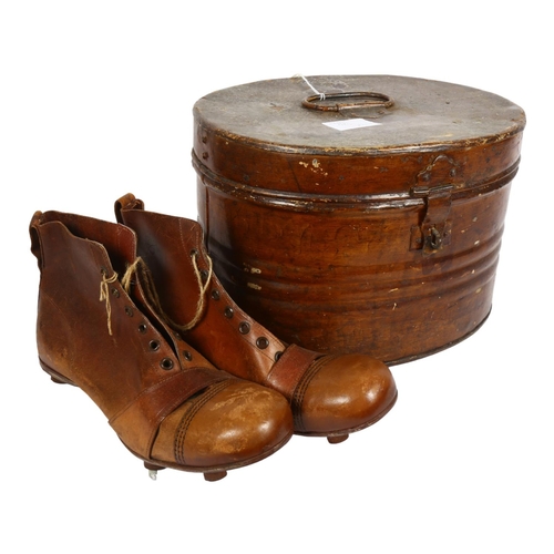 177 - A Victorian tin port manto, and a pair of Vintage leather football boots