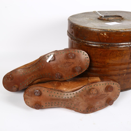 177 - A Victorian tin port manto, and a pair of Vintage leather football boots