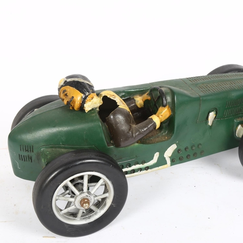 189 - A composite model of a racing car and driver, L42cm