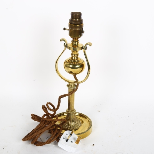 194 - A polished brass gimballed wall light, H30cm