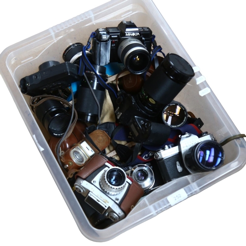 252 - A quantity of Vintage cameras, lenses and associated equipment, including a Minolta 7000, a Canon EO... 