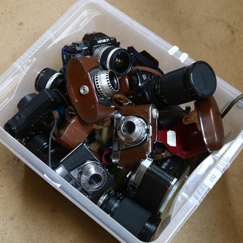 252 - A quantity of Vintage cameras, lenses and associated equipment, including a Minolta 7000, a Canon EO... 