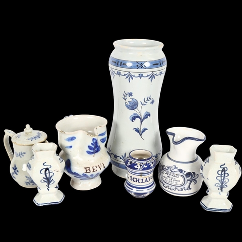 281 - A group of European blue and white tin glazed pottery, including large drug jar, water jug, Delft va... 