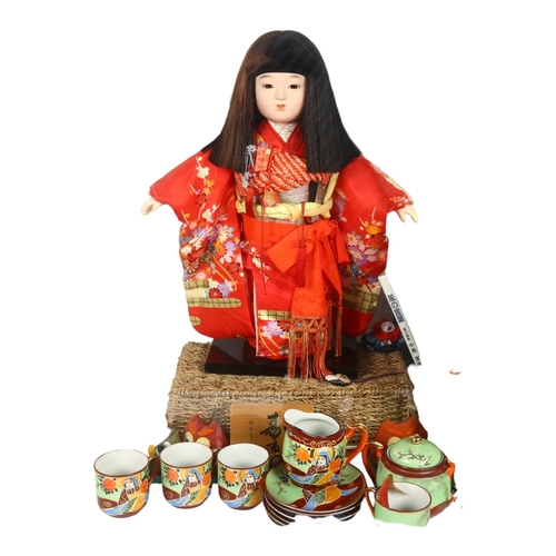 282 - A Japanese Ichimatsu doll, in a glass display case, case height 60cm, and a quantity of genuine Samu... 