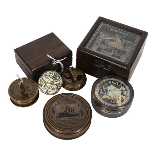 285 - A group of 3 brass compasses, 1 compass in presentation box with narrative regarding The Titanic, an... 